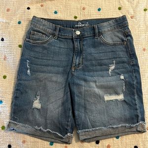 Distressed kids shorts with the coverings sewed into right side not the left.